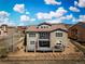 Beautiful home showcasing a spacious deck, fenced yard, and stunning mountain views at 15230 W Baker Ave, Lakewood, CO 80228