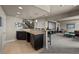 Spacious finished basement boasts a wet bar, media area, and plenty of room to entertain guests at 15230 W Baker Ave, Lakewood, CO 80228