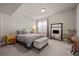Comfortable bedroom featuring neutral walls, carpet flooring, and bright natural light at 15230 W Baker Ave, Lakewood, CO 80228
