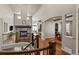The foyer provides access to an open living space, staircase and a view to the fireplace at 15230 W Baker Ave, Lakewood, CO 80228