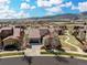 Charming single-Gathering home showcasing a well-manicured front lawn with an attached two-car garage at 15230 W Baker Ave, Lakewood, CO 80228