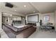 This expansive living room features a home theater system, wet bar, and comfortable furnishings at 15230 W Baker Ave, Lakewood, CO 80228