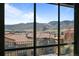 Enjoy the breathtaking mountain views from the comfort of this home's balcony and windows at 15230 W Baker Ave, Lakewood, CO 80228