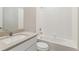 This bathroom features a single sink and vanity with a tub and shower at 48295 Shetland Dr, Bennett, CO 80102