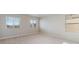 Neutral bedroom with plush carpeting, bright natural light, and classic window blinds at 48295 Shetland Dr, Bennett, CO 80102