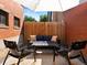 Outdoor patio seating with comfortable lounge furniture, creating an inviting space for relaxation and entertainment at 562 N Pennsylvania St, Denver, CO 80203