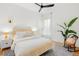 Bright bedroom featuring a ceiling fan, wood floors, rug, and rocking chair with a charming aesthetic at 562 N Pennsylvania St, Denver, CO 80203