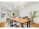Open-concept dining area with modern light fixture and seamless access to living room at 562 N Pennsylvania St, Denver, CO 80203