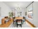 Elegant dining room featuring modern lighting, hardwood floors, and sleek décor at 562 N Pennsylvania St, Denver, CO 80203