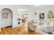 Open living area with hardwood floors flowing into a dining area with bright, natural light at 562 N Pennsylvania St, Denver, CO 80203