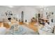 Spacious living room with hardwood floors, modern decor, and an open layout into the dining area at 562 N Pennsylvania St, Denver, CO 80203