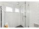 Modern glass shower with subway tile walls, a shower head, and fixtures for a sleek look at 562 N Pennsylvania St, Denver, CO 80203