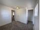 A carpeted bedroom with two windows, closet, and neutral decor creates a serene and inviting space at 2429 S Cherokee St, Denver, CO 80223