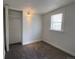 Bright bedroom with a built-in closet and window, offering a cozy and functional space at 2429 S Cherokee St, Denver, CO 80223