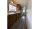 Well-lit kitchen with wooden cabinets, offering ample storage space and functional design at 2429 S Cherokee St, Denver, CO 80223