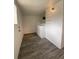 Functional laundry area with modern appliances and shelving for storage and organization at 2429 S Cherokee St, Denver, CO 80223