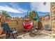 Cozy backyard patio with comfortable seating, shaded by trees and an umbrella at 5722 S Addison Way # A, Aurora, CO 80016