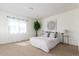 Bright bedroom featuring a plush bed, neutral tones, and ample natural light at 5722 S Addison Way # A, Aurora, CO 80016