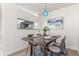 Cozy dining area with a modern table setting and an open kitchen view at 5722 S Addison Way # A, Aurora, CO 80016