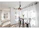 Bright dining area featuring a table, chairs, and natural light at 5722 S Addison Way # A, Aurora, CO 80016
