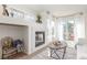 Bright living room featuring a fireplace, natural light, and cozy decor at 5722 S Addison Way # A, Aurora, CO 80016