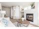 Bright living room with a cozy fireplace, neutral tones and modern decor at 5722 S Addison Way # A, Aurora, CO 80016