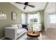Stylish living room with green walls, modern furniture, and decorative accents at 5722 S Addison Way # A, Aurora, CO 80016
