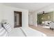 Comfortable main bedroom with en suite bath and bonus seating area at 5722 S Addison Way # A, Aurora, CO 80016