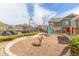 Neighborhood playground with swing, slide, and wood chip ground cover at 5722 S Addison Way # A, Aurora, CO 80016