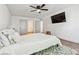 Bright bedroom with hardwood floors and ceiling fan at 300 S Clinton St # 8C, Denver, CO 80247