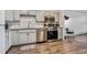 Modern kitchen with stainless steel appliances and granite countertops at 300 S Clinton St # 8C, Denver, CO 80247