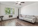 Living room with hardwood floors and a ceiling fan at 300 S Clinton St # 8C, Denver, CO 80247