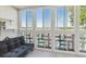 Sunroom with floor to ceiling windows and city views at 300 S Clinton St # 8C, Denver, CO 80247