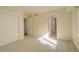 Inviting bedroom with neutral carpet, and multiple doors, offering a calming atmosphere at 9554 E Hidden Hill Ln, Lone Tree, CO 80124