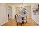 Formal dining room features a modern chandelier and hardwood floors at 9554 E Hidden Hill Ln, Lone Tree, CO 80124