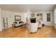 Bright living room boasting hardwood floors, a fireplace, built-in shelving and comfortable seating at 9554 E Hidden Hill Ln, Lone Tree, CO 80124