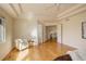 Main bedroom with hardwood floors, neutral walls, ceiling fan, and tray ceiling at 9554 E Hidden Hill Ln, Lone Tree, CO 80124