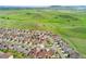 An aerial view of the home in the surrounding community with gorgeous mountain views at 19316 W 84Th Pl, Arvada, CO 80007