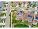 Aerial view of a single Gathering home with solar panels and landscaped front yard on a corner lot at 19316 W 84Th Pl, Arvada, CO 80007