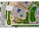 An aerial view of a landscaped yard, with a manicured lawn and privacy fence at 19316 W 84Th Pl, Arvada, CO 80007