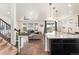 Bright and airy living space featuring hardwood floors, granite counters, and modern decor at 19316 W 84Th Pl, Arvada, CO 80007