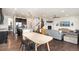 Open living room and dining area, hardwood floors and stainless steel kitchen at 19316 W 84Th Pl, Arvada, CO 80007