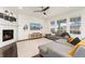 Cozy living room featuring a fireplace, comfortable seating, and ample natural light at 19316 W 84Th Pl, Arvada, CO 80007