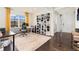 Bright and spacious home office featuring custom built-ins and a large window at 19316 W 84Th Pl, Arvada, CO 80007