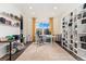 Spacious home office featuring custom built-ins and ample workspace at 19316 W 84Th Pl, Arvada, CO 80007