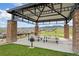 Community pavilion with picnic tables and barbecue grill showcasing distant mountain views at 19316 W 84Th Pl, Arvada, CO 80007