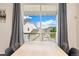 Sunny dining area with sliding glass doors to a deck overlooking the neighborhood at 19316 W 84Th Pl, Arvada, CO 80007