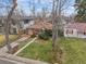 An aerial view of the charming brick home with a landscaped yard at 1665 S Saint Paul St, Denver, CO 80210