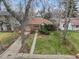 An aerial view of the charming brick home with a landscaped yard at 1665 S Saint Paul St, Denver, CO 80210
