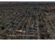 Aerial view of home showing lot lines with a view of the nearby city skyline at 1665 S Saint Paul St, Denver, CO 80210